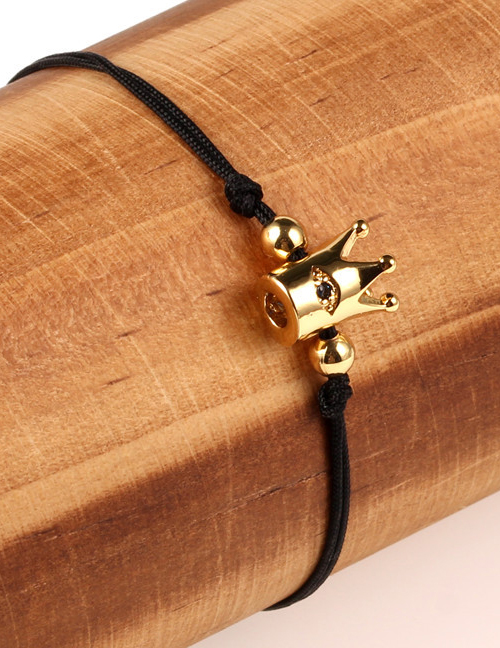 Fashion Crown Eye Black Plated Gold And Diamond Braided Hand Rope