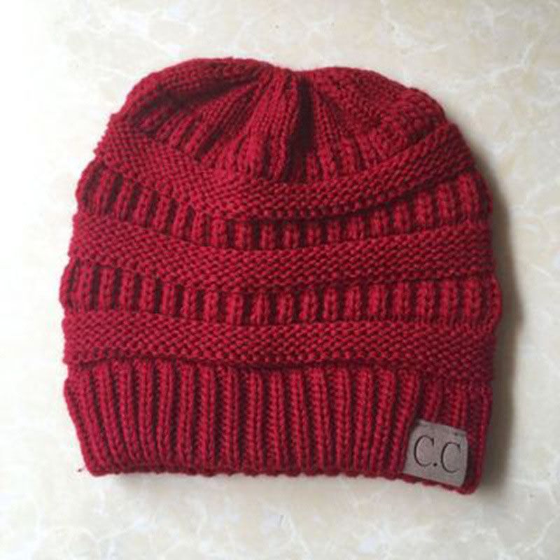 Fashion Claret Solid Color Knitted Label Empty Top Beanie