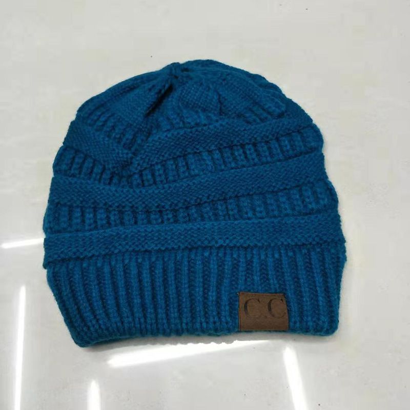 Fashion Peacock Blue Solid Color Knitted Label Empty Top Beanie