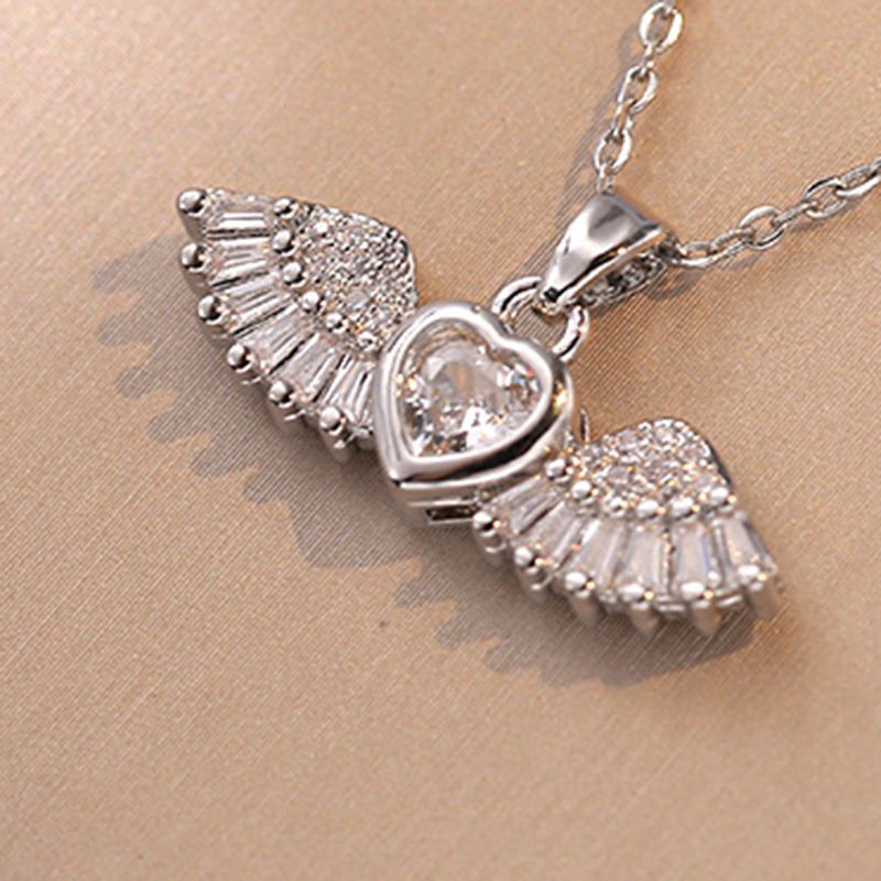 Fashion Gangse Angel Wings Titanium Steel Diamond Heart Wings Pendant
