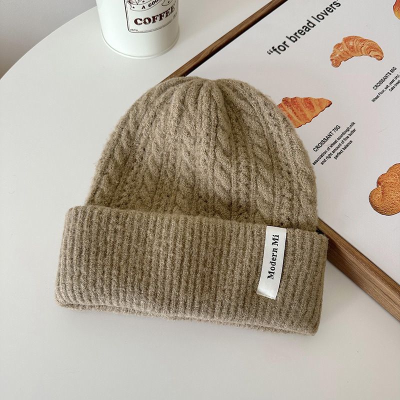 Fashion Oatmeal Color Polyester Twist Knitted Patch Beanie