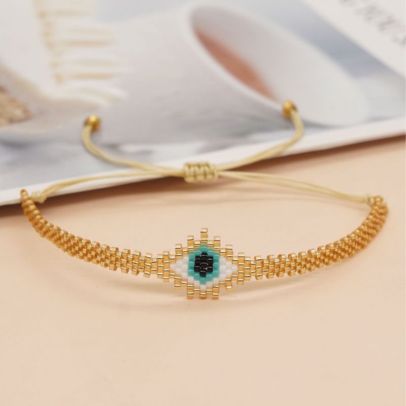 Fashion Gold Rice Beads Braided Eyes Bracelet