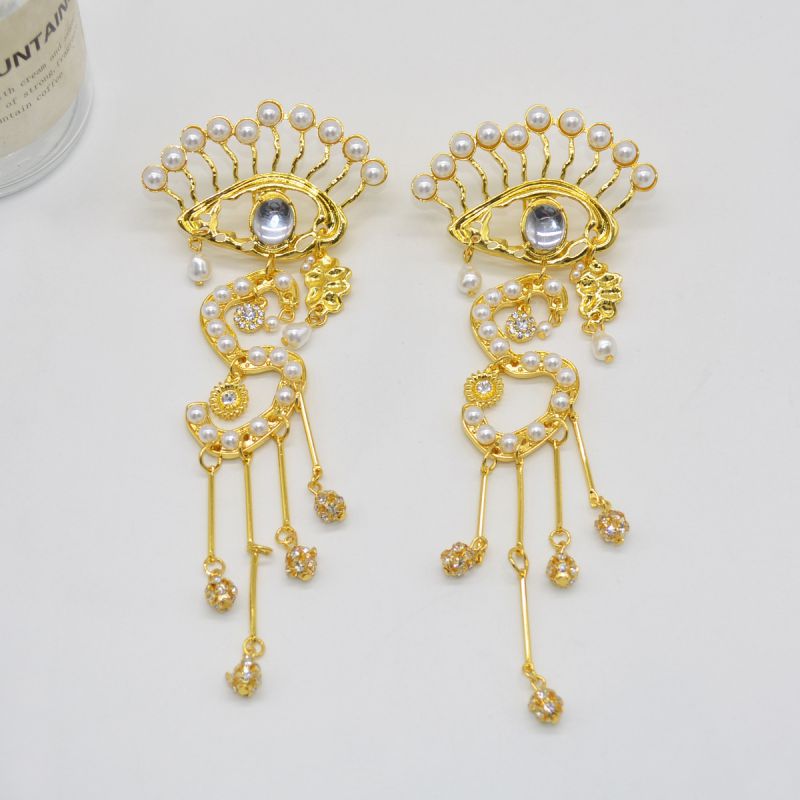 Fashion Gold Alloy Pearl Eye Tassel Earrings