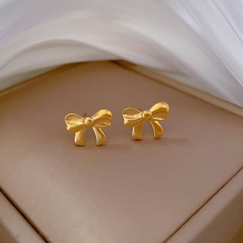 Fashion Gold Titanium Steel Bow Earrings