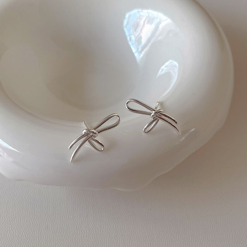 Fashion Silver Bow Earrings Plated With Real Gold Metal Knotted Bow Stud Earrings